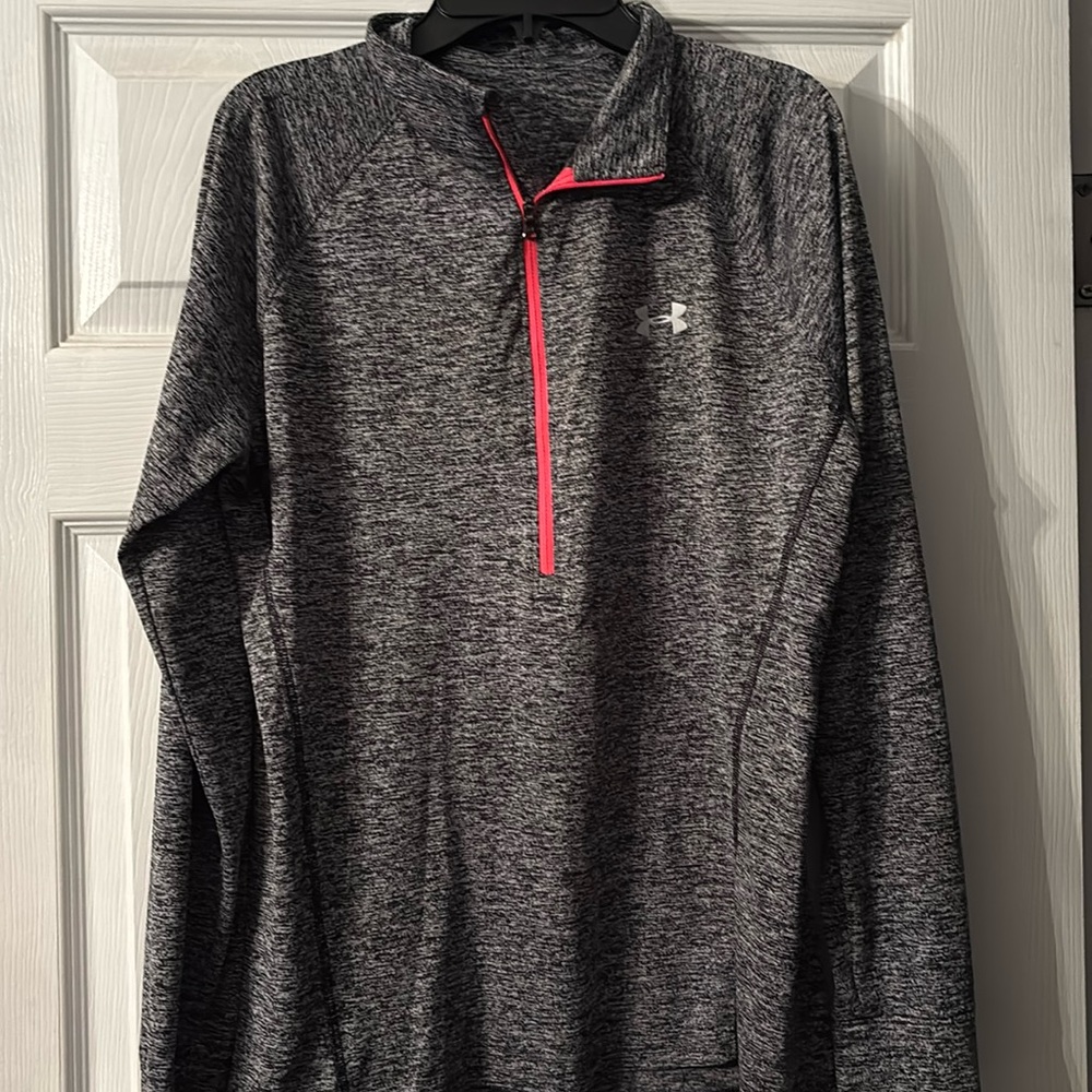 3 Women’s large under Armour sport shirts. Black, Blue, and pink.